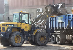 Skip Hire in Chelmsford loading a lorry